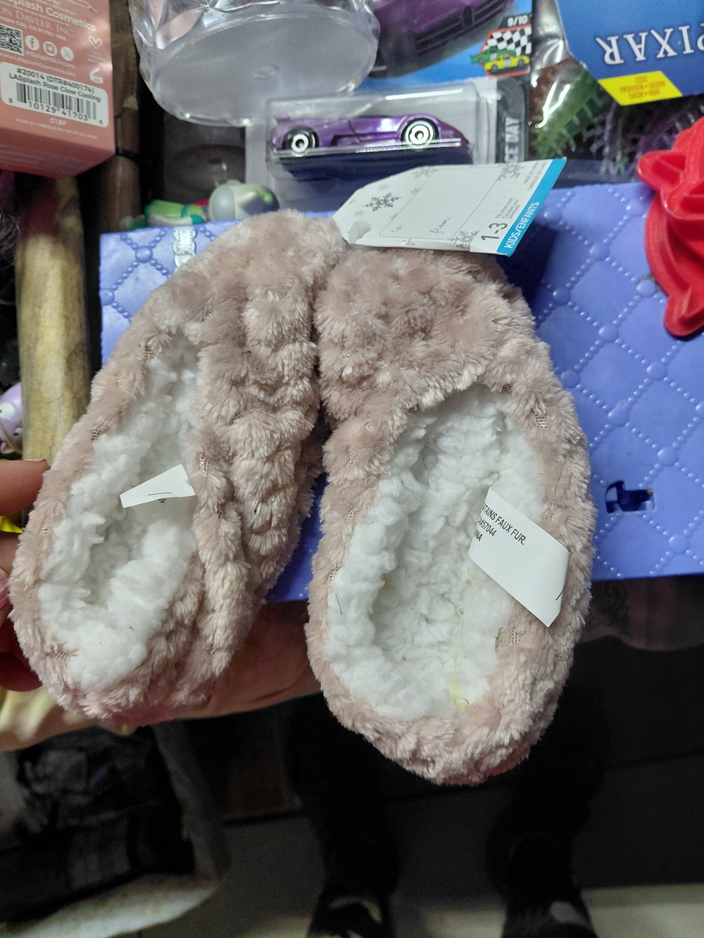 cozy mauve fluffy slippers featuring a soft white sherpa lining